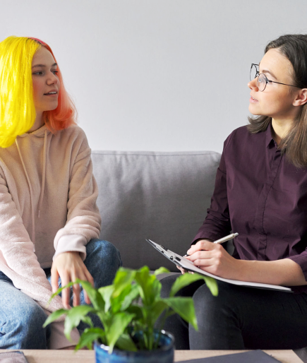 therapist and female teen talking